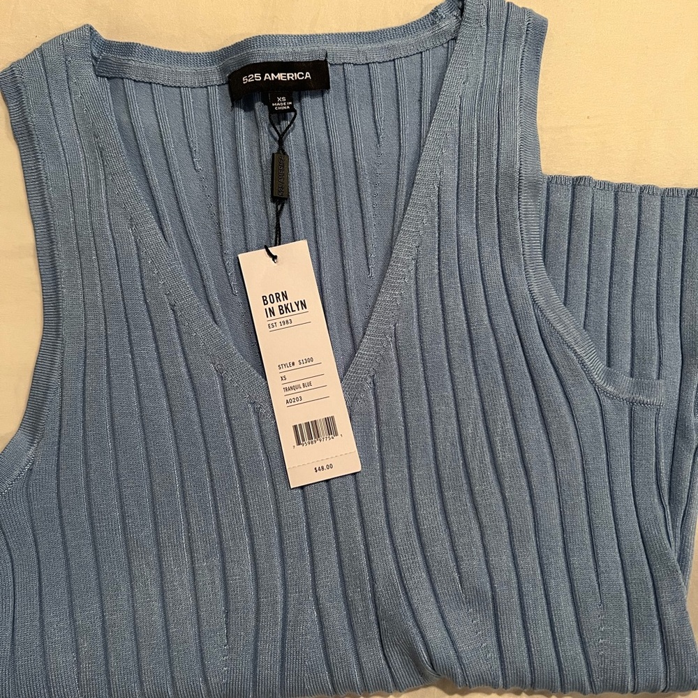 Blue tank top. Brand new! So nice just too small for me!